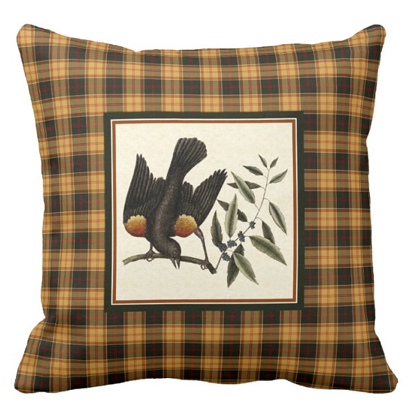 Red winged blackbird with gold plaid pillow