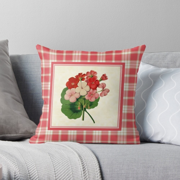 Coral pink plaid with vintage geraniums throw pillow